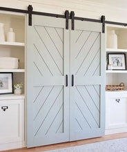 Load image into Gallery viewer, Barn doors with geometric pattern in a home interior setting
